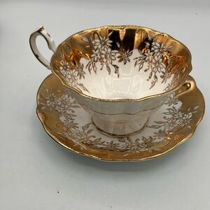Elegant Queen Anne  Gold and White Floral Teacup and Saucer Set